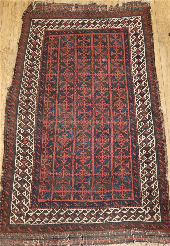 An Afghan dark brown ground rug 168 x 97cm